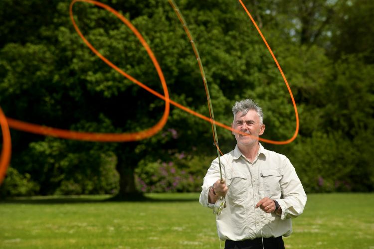 A man casting off a fishing line