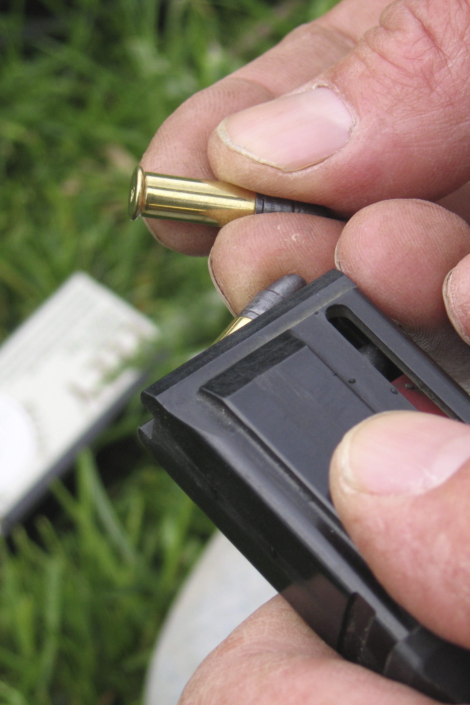 Hand loading 38-grain Eley Subsonic .22LR rounds into a CZ 457 rifle magazine