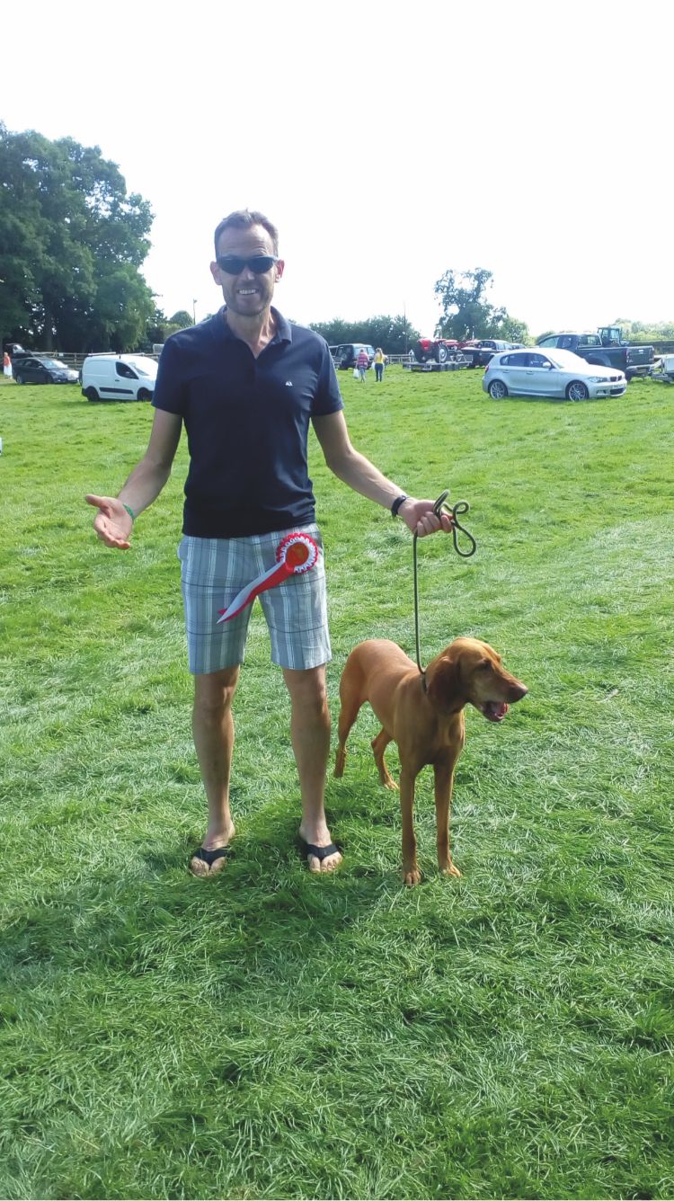 owner and vizsla 